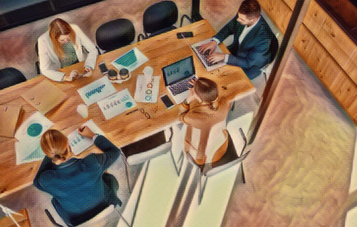 Males and females around a boardroom table