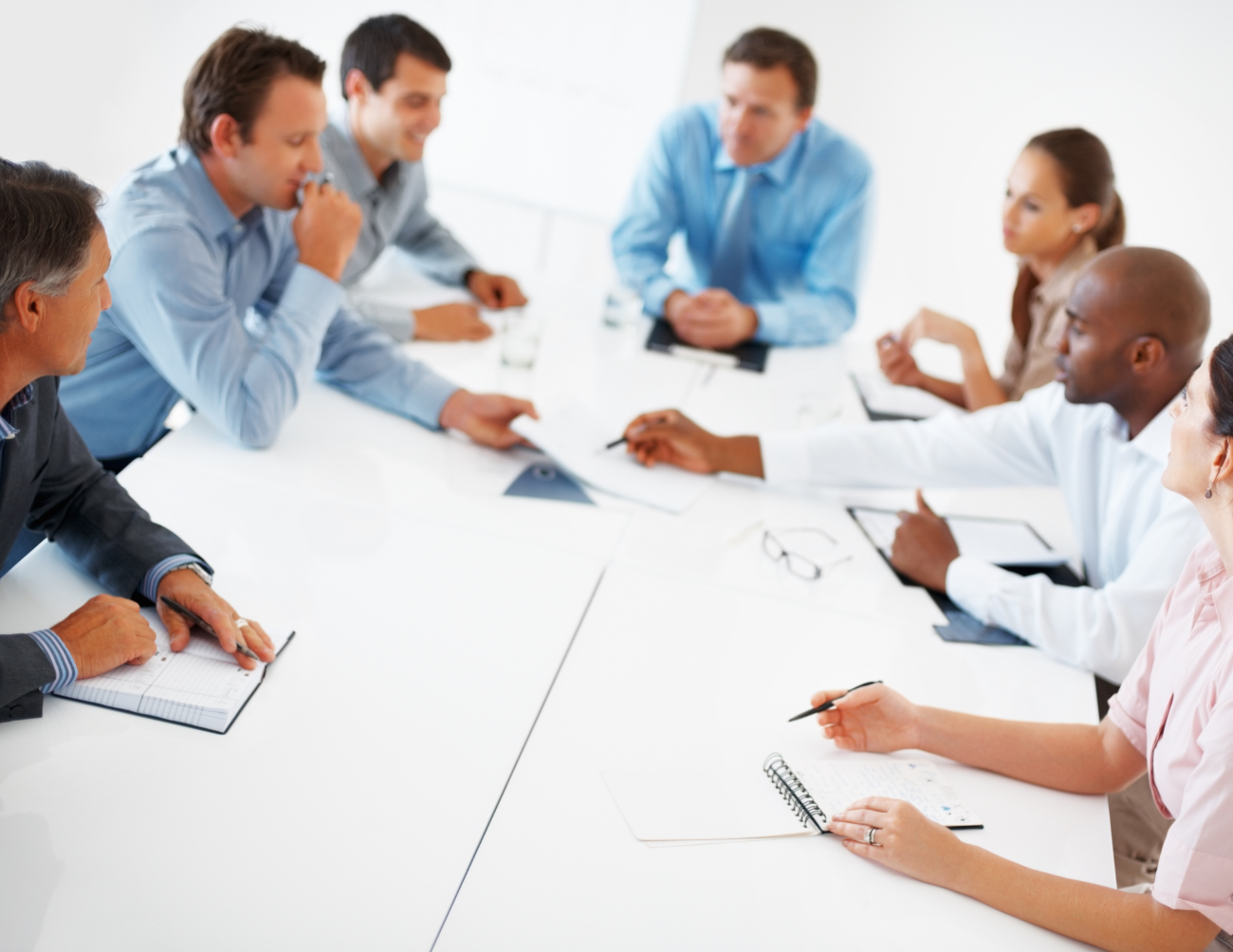 Business men and women in a meeting