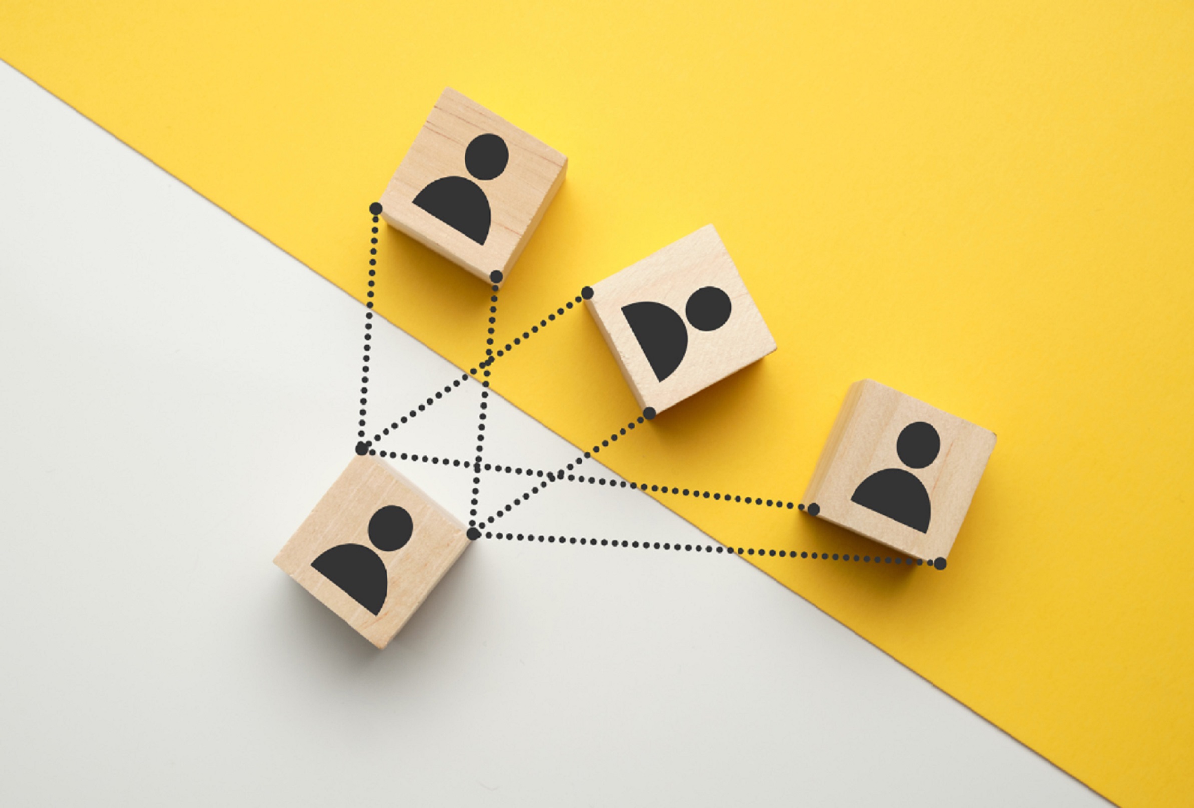 Representation of job interview scenario using scrabble tiles and people icons