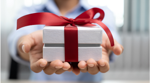 Person offerring a gift with outstretched hands