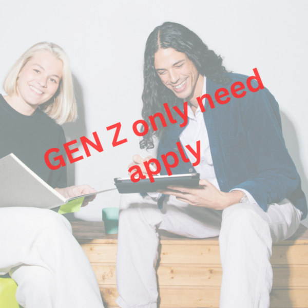 Two young people smiling with books and laptop