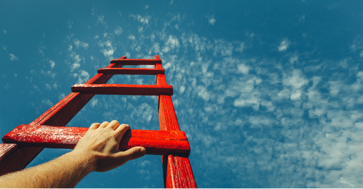 Man's hand on red ladder going up into the sky
